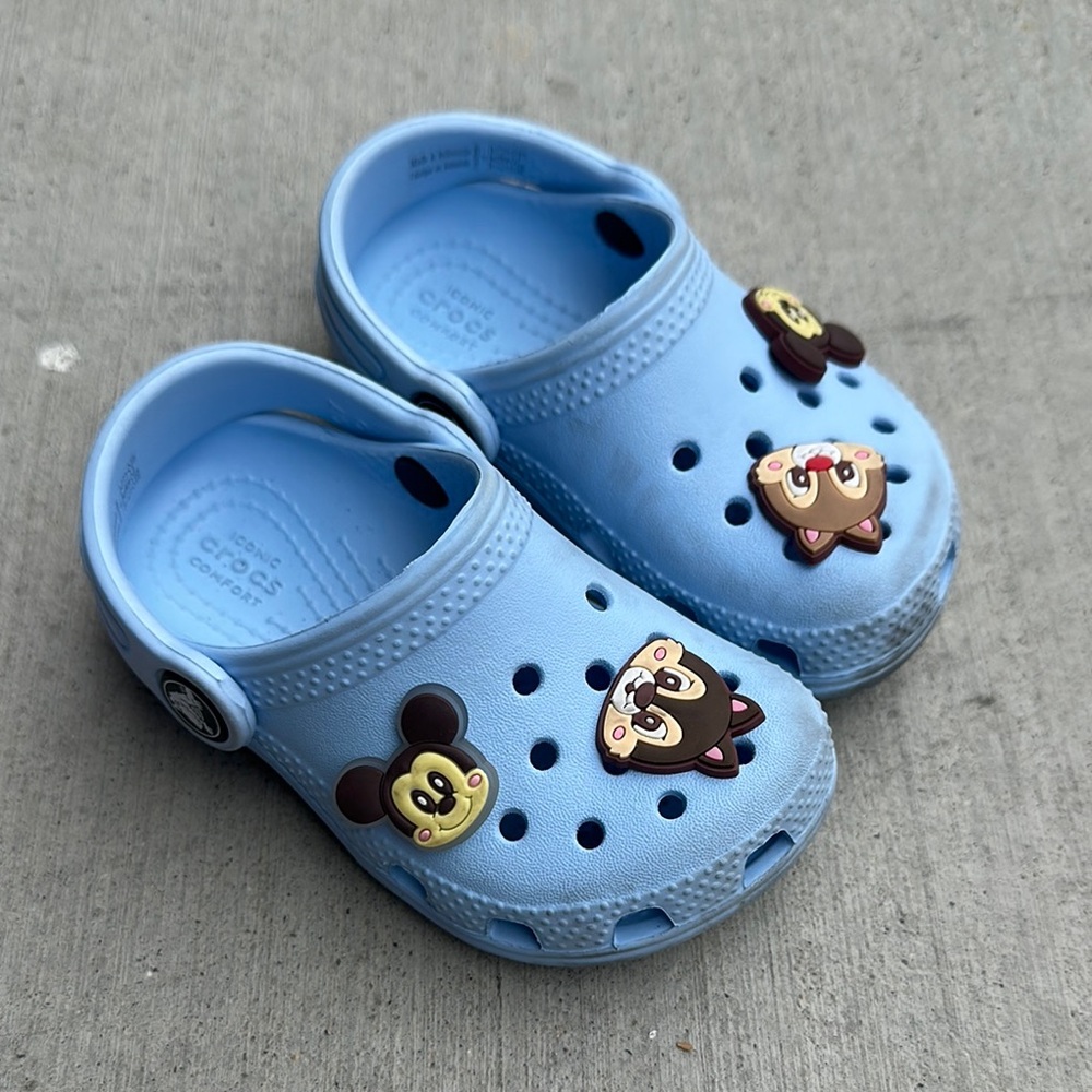 Toddler size 7 Blue Crocs with Cartoon Charms